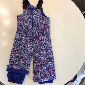 Burton ski or snowboard pants purple. Flower pattern in pink, purple, blue.